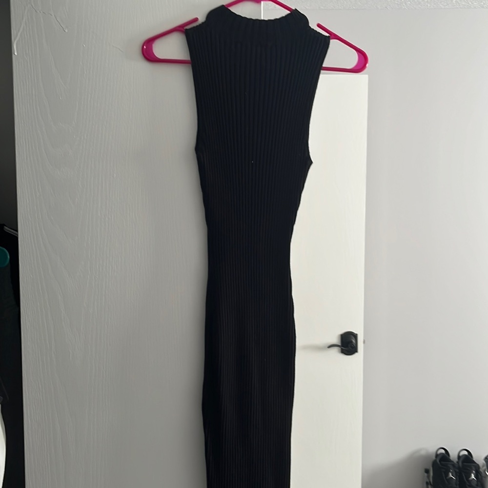 Sexy and sleek black dress. Size Small.